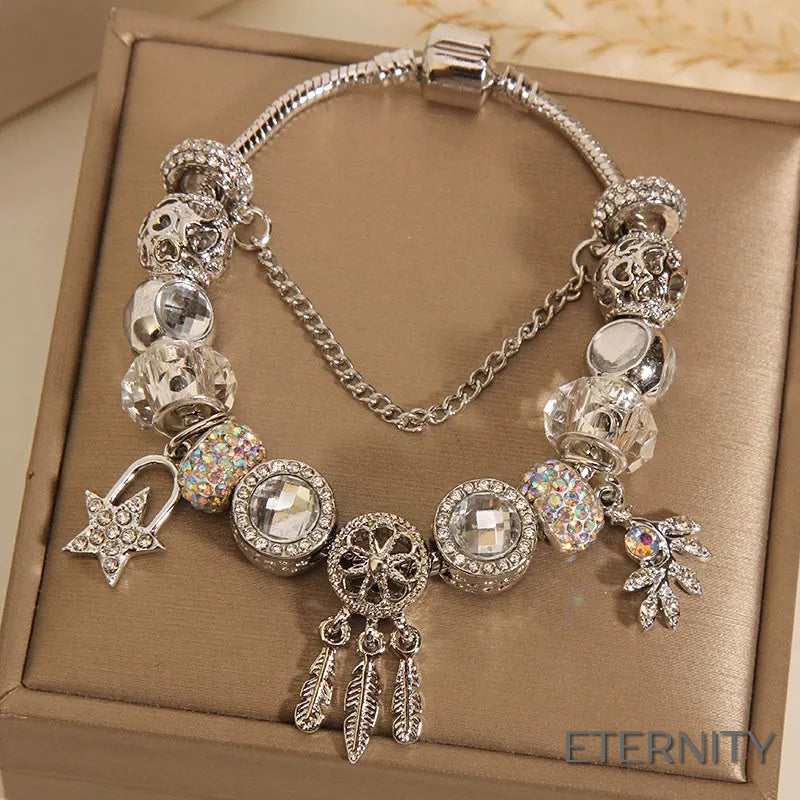 Brazalete Plateado Estilo Pandora con Dijes de Atrapasueños, Estrella y Corazón Alado - ETERNITY