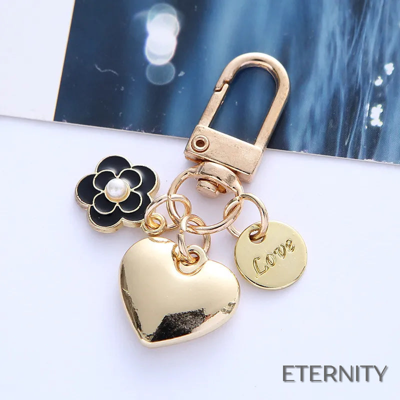 Adorables Llaveros Femeninos con Corazón Liso, Flor con Perla y Mensaje de Amor - ETERNITY