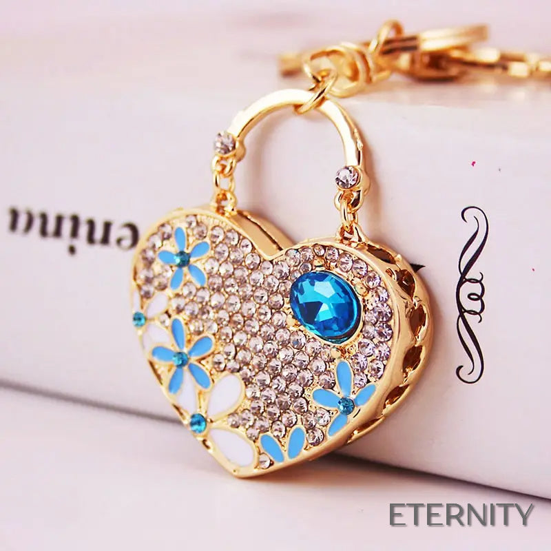 Llavero Dorado con Corazón Brillante, Flores Esmaltadas y Gemas - ETERNITY