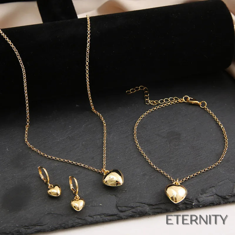 Set de Collar, Pulsera y Zarcillos de Corazón Abultado en Dorado - ETERNITY