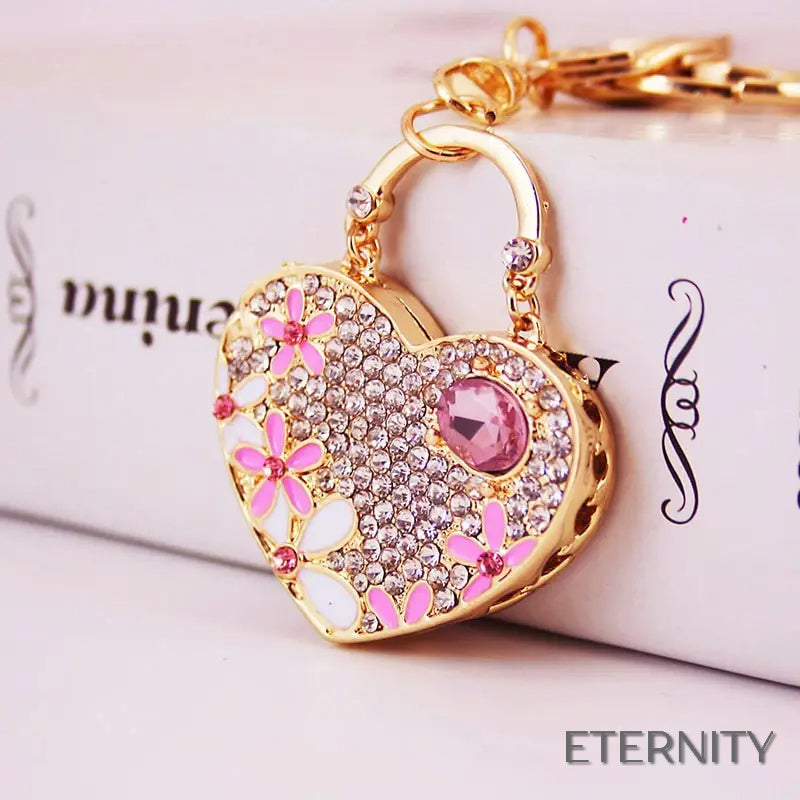 Llavero Dorado con Corazón Brillante, Flores Esmaltadas y Gemas - ETERNITY