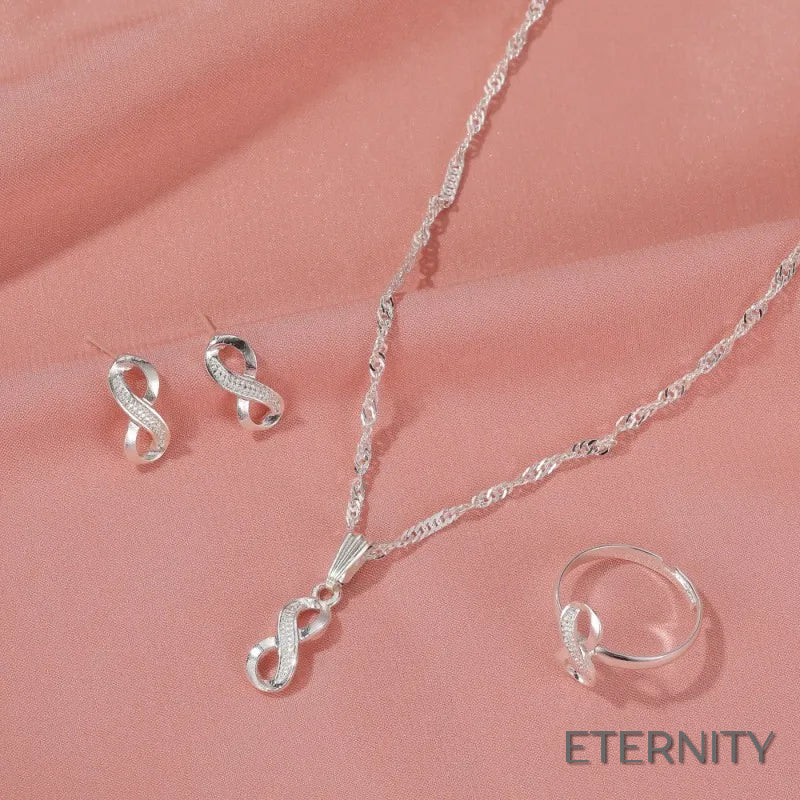 Conjunto Femenino de Collar Zarcillos y Anillocon Diseño de Infinito Adornado con Circonitas - ETERNITY