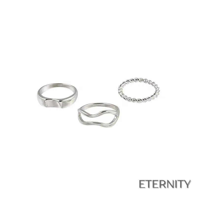 Set de Tres Anillos Dorados con Forma Ondulada y Trenzada - ETERNITY
