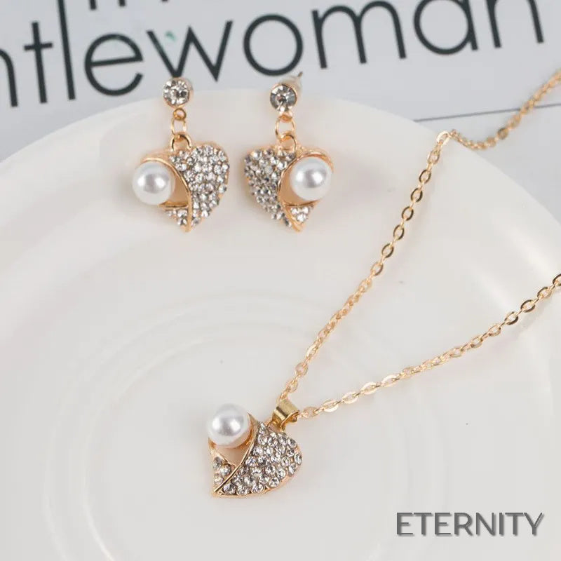 Set Romántico Dorado: Collar y Zarcillos con Forma de Corazón, Perla y Rhinestones