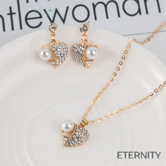Set Romántico Dorado: Collar y Zarcillos con Forma de Corazón, Perla y Rhinestones