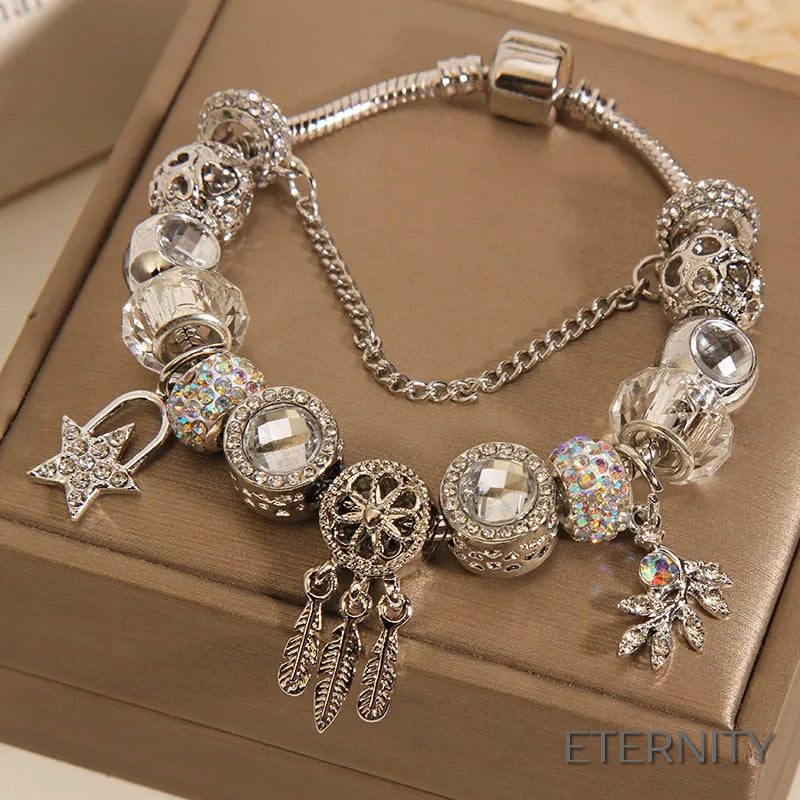 Brazalete Plateado Estilo Pandora con Dijes de Atrapasueños, Estrella y Corazón Alado - ETERNITY