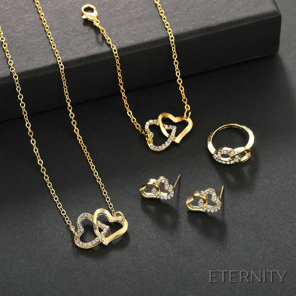 Conjunto Femenino de Cuatro Piezas: Corazones Entrelazados en Dorado: Cadena, Pulsera, Anillo y Zarcillos - ETERNITY
